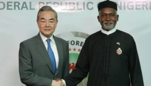 Chinese Foreign Minister Wang Yi (L) with Nigeria’s Foreign Affairs Minister Yusuf Tuggar (R) during Minister Wang’s diplomatic visit to Abuja on 9 January 2025. (Kola Sulaimon/AFP)