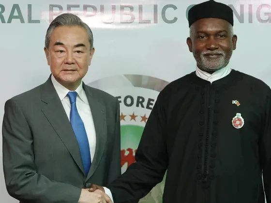 Chinese Foreign Minister Wang Yi (L) with Nigeria’s Foreign Affairs Minister Yusuf Tuggar (R) during Minister Wang’s diplomatic visit to Abuja on 9 January 2025. (Kola Sulaimon/AFP)