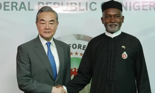 Chinese Foreign Minister Wang Yi (L) with Nigeria’s Foreign Affairs Minister Yusuf Tuggar (R) during Minister Wang’s diplomatic visit to Abuja on 9 January 2025. (Kola Sulaimon/AFP)