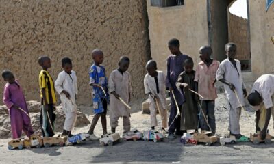 Boys play outside a bakery in Dapchi, in the northeastern state of Yobe, Nigeria March 22, 2018. REUTERS/Afolabi Sotunde/File Photo